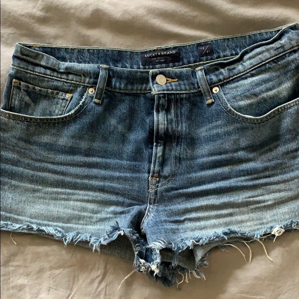 Lucky Bran mid rise cut off shorts.